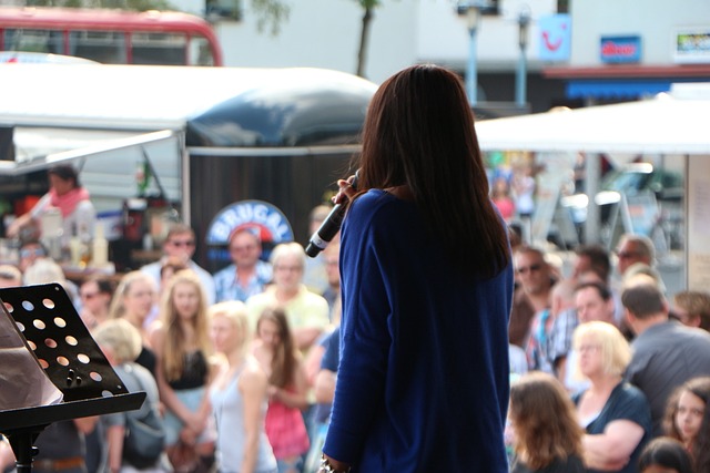 Girl singing to crowd