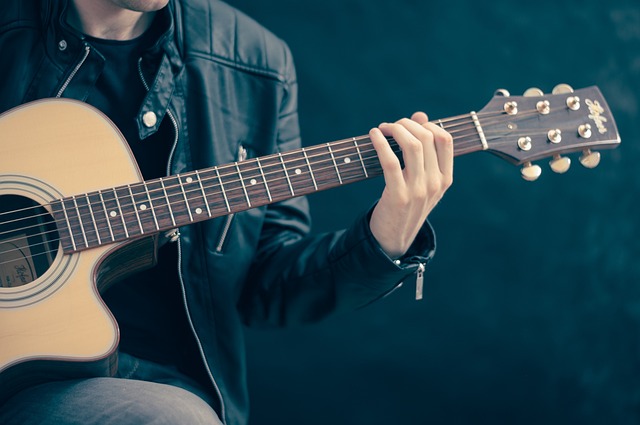 Guy playing guitar